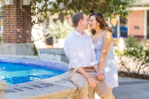 Engagement photography session with a fountain in Downtown Winter Garden near Orlando by top engagement photographer
