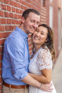 Engagement photography session in Orlando with brick wall and old vintage buildings in Winter Garden