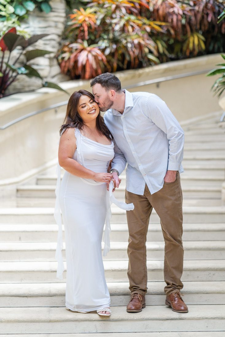 Classy and elegant engagement photography session featuring a staircase at Gaylord Palms resort in Kissimmee Florida