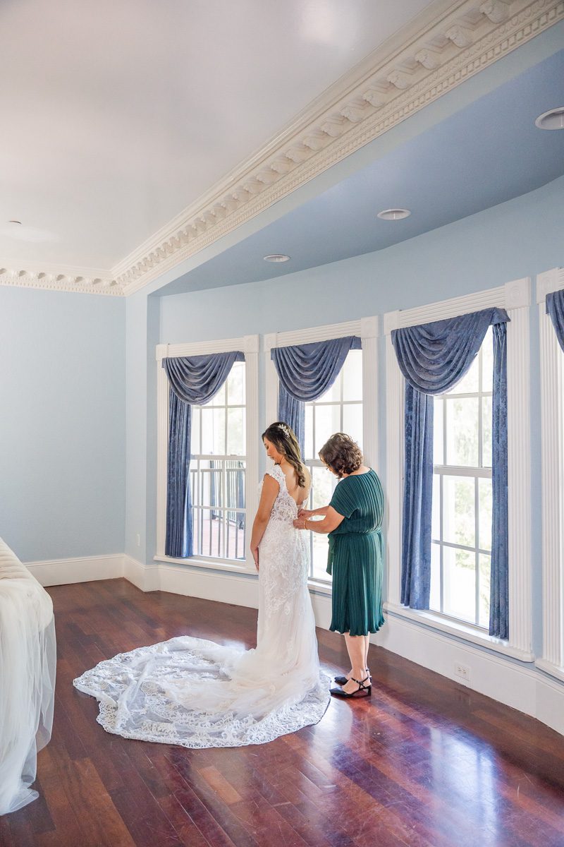 Orlando wedding photographer and videographer capture Bride getting ready at Luxmore Grande Estate