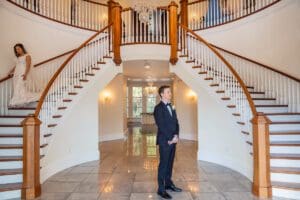 Romantic first look on staircase at Luxmore Grande Estate venue near Orlando Florida