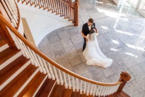 Romantic first look on staircase at Luxmore Grande Estate venue near Orlando Florida