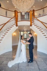 Romantic first look on staircase at Luxmore Grande Estate venue near Orlando Florida
