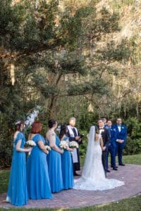 Sky blue bridesmaids at outdoor ceremony at Luxmore Grand Estate