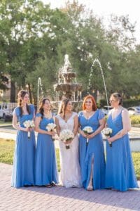 Sky blue bridesmaids at outdoor ceremony at Luxmore Grand Estate