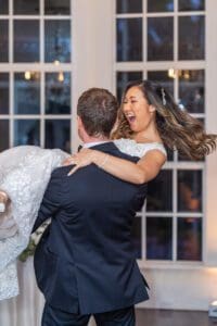 Joyful fun romantic reception photos with a creative shutter drag and dancing by top Orlando photo and video