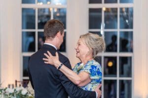 Joyful fun romantic reception photos with a creative shutter drag and dancing by top Orlando photo and video