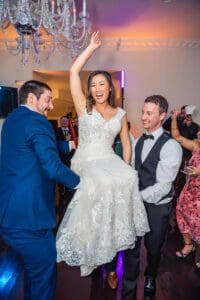 Fun candid dancing shots at Luxmore Grande Estate wedding reception by Orlando photographer