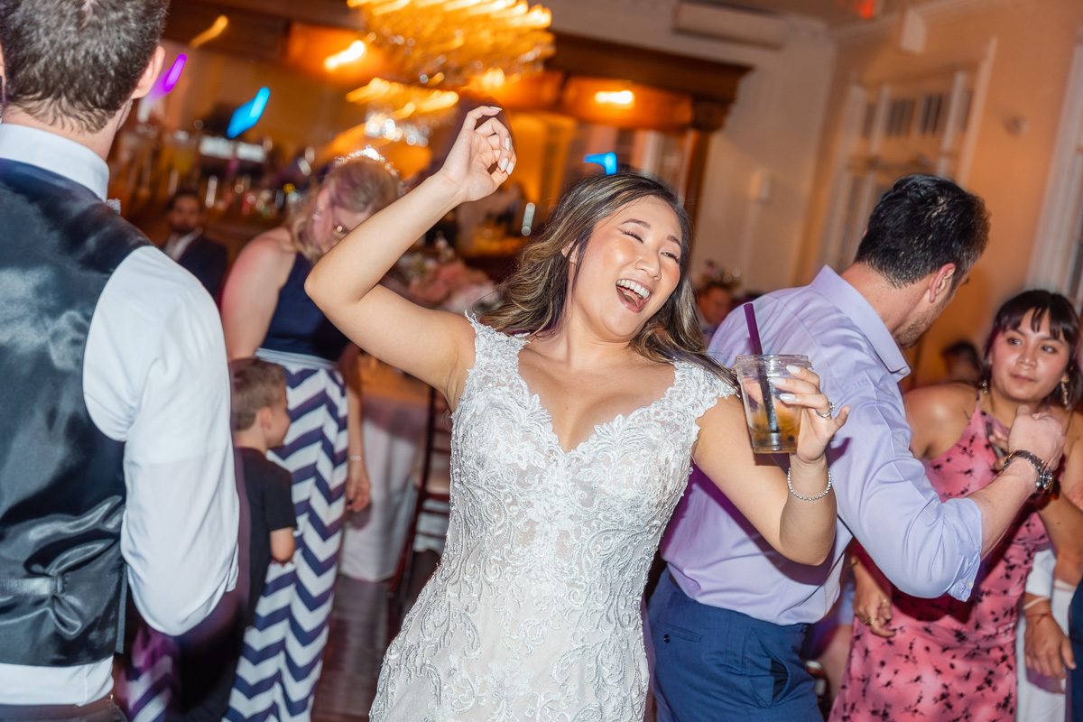 Fun candid dancing shots at Luxmore Grande Estate wedding reception by Orlando photographer