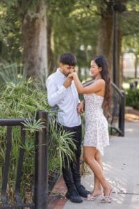 Emotional surprise proposal moment at Lake Eola in downtown Orlando captured by a professional Orlando proposal photographer.