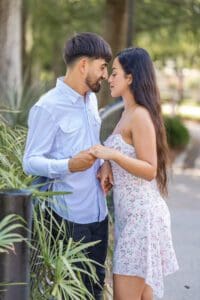 Candid portraits after a surprise proposal at Lake Eola showcasing downtown Orlando scenery and waterfront views.