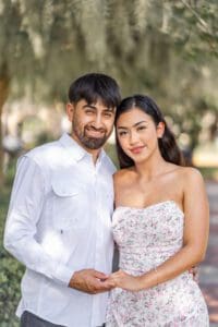 Proposal photography at Lake Eola in Orlando featuring a rose petal heart and fountain backdrop.