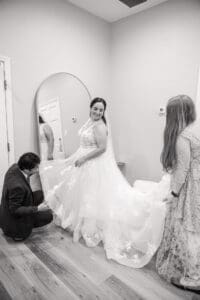 Bride getting into her wedding dress before her intimate Harry P. Leu Gardens wedding in Orlando.