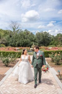 Timeless wedding portrait of newlyweds surrounded by blooming gardens at Harry P. Leu Gardens.