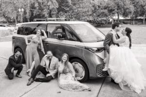 Bride and groom climbing into their getaway VW bus after their Harry P. Leu Gardens wedding.