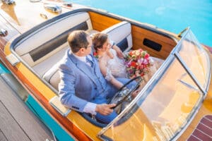 Bride and groom relax aboard a classic boat at Evermore Resort in Orlando, photographed by Captured by Elle, leading Orlando wedding photographer & videographer
