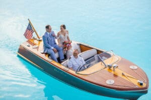 Aerial-inspired portrait of newlyweds enjoying a private boat ride at Evermore Resort in Orlando, photographed by Captured by Elle wedding photographer & videographer.