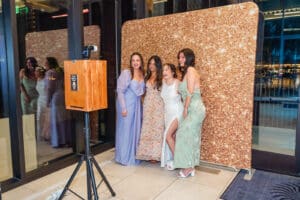 Wedding guests enjoy a fun photo booth experience at Evermore Resort in Orlando, beautifully documented by Captured by Elle wedding photographer & videographer