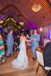 Bride and groom share joyful dances with family and friends during their Evermore Resort Orlando wedding, Captured by Elle Photography & Videography