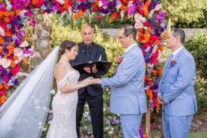 An emotional ring exchange during an elegant Evermore Resort wedding ceremony in Orlando, photographed by Captured by Elle