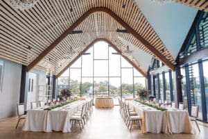 Modern Evermore Resort wedding reception in Orlando featuring soaring architecture and waterfront views, photographed by Captured by Elle, Orlando wedding photographer & videographer