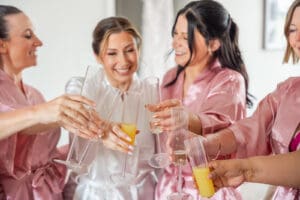 Bridesmaids celebrating with a champagne toast before the ceremony at Evermore Resort in Orlando, captured by Captured by Elle wedding photography & videography