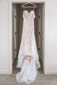 Romantic bridal gown detail hanging before the ceremony at Evermore Resort in Orlando, captured by luxury wedding photographer & videographer Captured by Elle