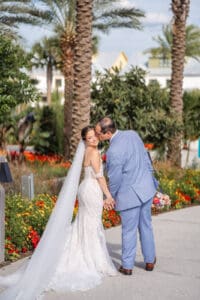 A joyful stroll through Evermore Resort's lush gardens in Orlando showcases timeless wedding photography by Captured by Elle, luxury wedding photographer & videographer.